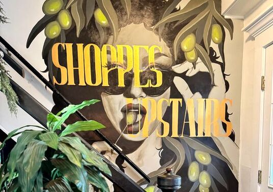 The Shoppes Upstairs mural at Olive's Eatery